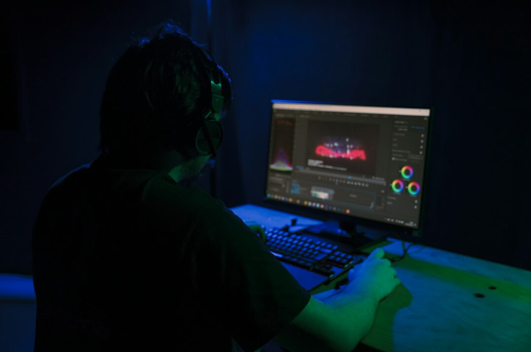 video editor working on computer