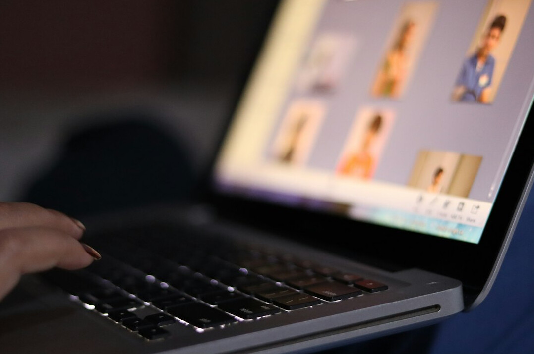 person watching video on laptop